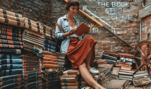 A reader surrounded by books, illustrating the Patricia Julie blog